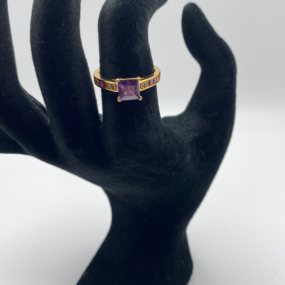 Purple Crystal Stone With Multiple Different Colors Around Band